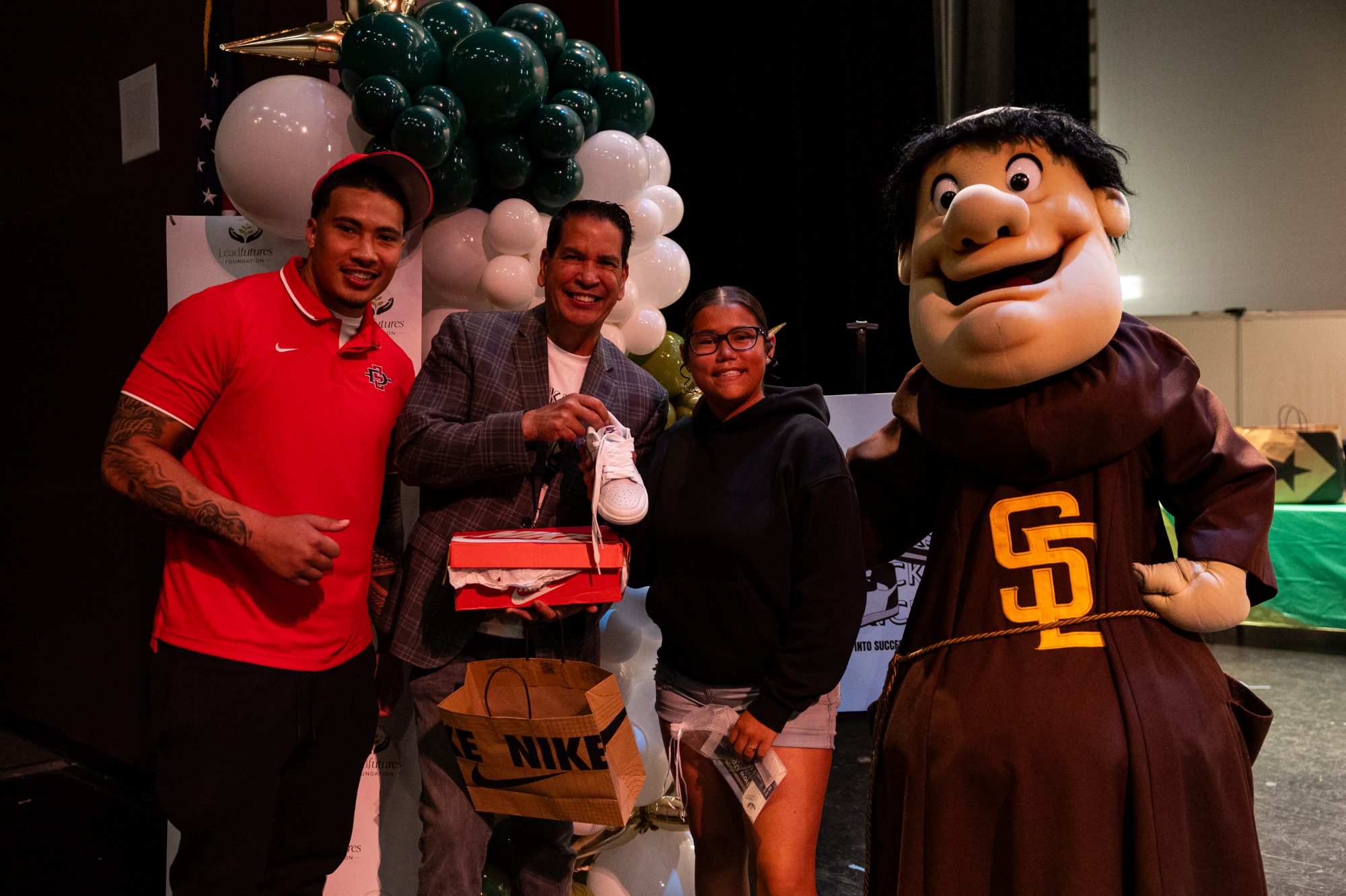 A student receiving new shoes at the EVOKicks reveal